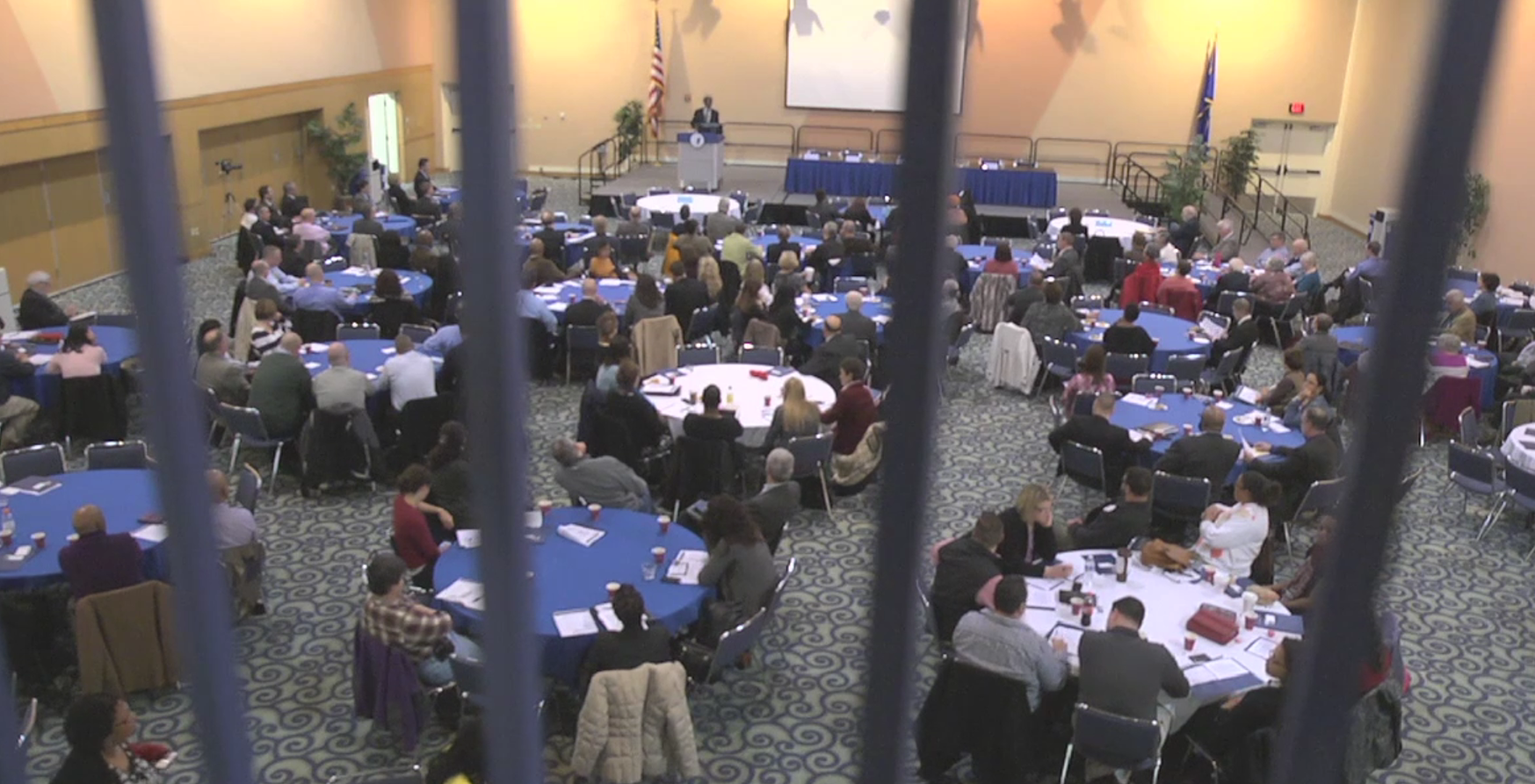 Gathering of the 2014 Building Bridges Meeting with view of speaker and attendants