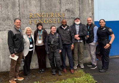group of people posed outside building