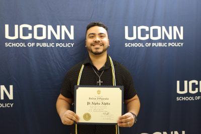 A man holds a certificate