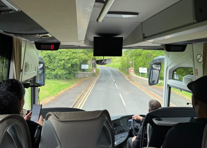 looking through front window of tour bus